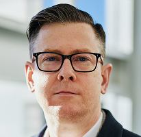 CEO-Porträt von Alexander Hughes, Geschäftsführer eines Krypto-Handelsunternehmens